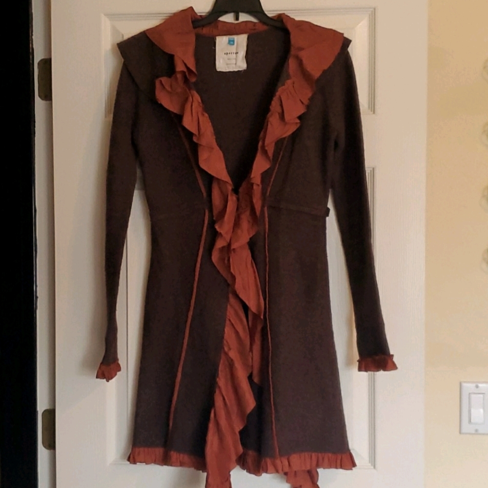 Boutique coat. Wool coat and silk ruffle and trim.